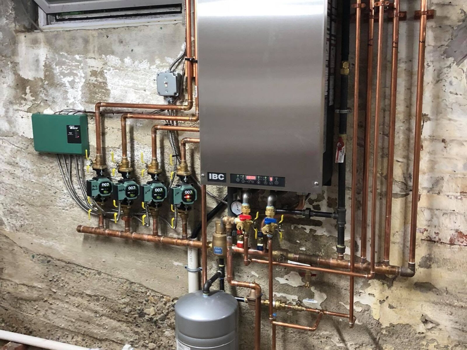 High-efficiency boiler and copper piping installed by Main Street Plumbing
